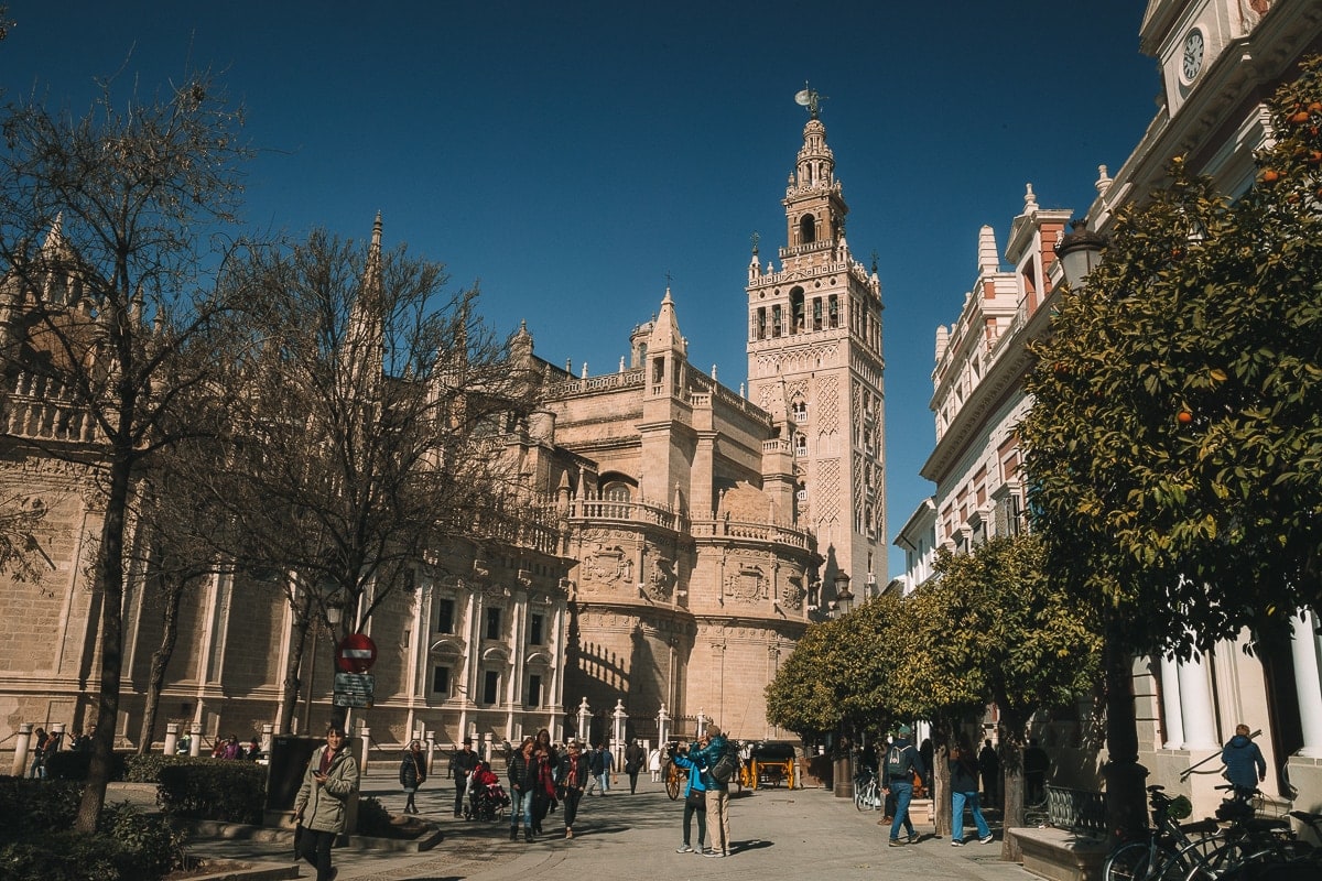 People in front of the cathedral in Seville